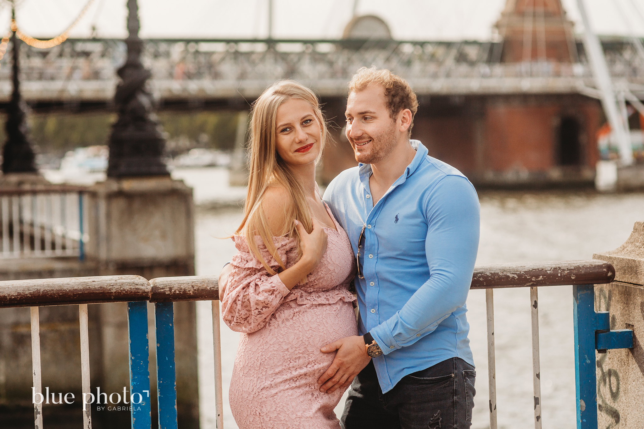 Angelika and Wojtek during their maternity session in South Bank, Central London. The couple is smiling. 